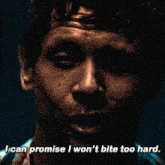 a close up of a man 's face with the words " i can promise i won 't bite too hard "