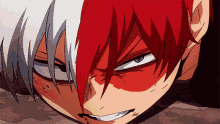 a close up of a person 's face with red hair
