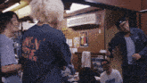 a man wearing a shirt that says ' guns n ' roses ' on it