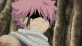 a close up of a person with pink hair and a scarf around their neck