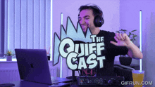 a man wearing headphones stands in front of a laptop with the quiff cast logo behind him