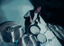 a man is playing drums with a set of zildjian drums