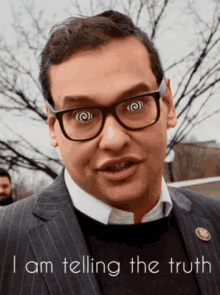 a man in a suit and glasses is telling the truth