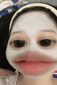 a woman with a white mask on her face looks like a duck