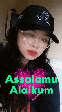 a girl wearing glasses and a hat with the words assalamu alaikum above her