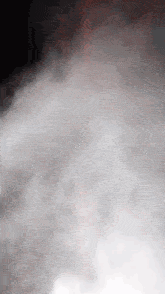 a black background with a lot of white clouds