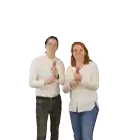 a man and a woman holding a confetti cannon that says ' snickers ' on it