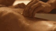 a person is giving a massage to another person .