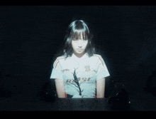 a woman 's face is projected on a screen with a sweater that says ' abercrombie & fitch '