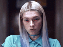 a close up of a woman 's face with blonde hair