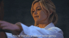 a woman is wearing a white shirt and says you 're literally a fashion emergency