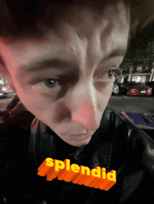 a close up of a person 's face with the word splendid on the bottom right