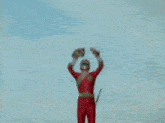 a red ninja warrior is fighting a white ninja warrior in a battle .