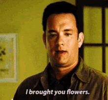 Tom Hanks I Brought You Flowers GIF - Tom Hanks I Brought You Flowers Flowers GIFs