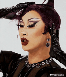 a close up of a woman 's face with t4yce tumblr in the lower right corner