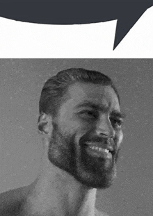 a man with a beard is smiling with a speech bubble in the background