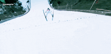 a person is skiing down a snow covered slope and the words lewanaria are on the bottom