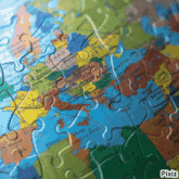 a map of europe is shown in a puzzle with pixiz written on the bottom