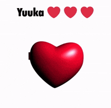 a red heart with a picture of a girl and the name yuuka above it