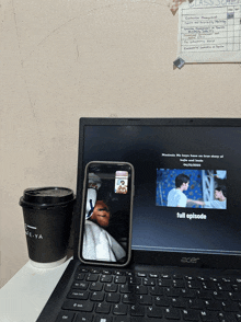 an acer laptop is open to a full episode of a show