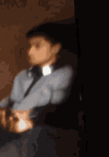 a blurry picture of a man wearing a shirt and tie
