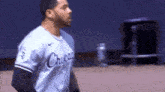 a baseball player is standing on a baseball field wearing a chicago uniform .