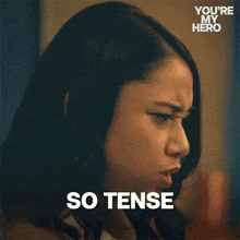a close up of a woman 's face with the words " so tense " above her