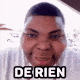 a man wearing a white shirt has the word de rien on his shirt