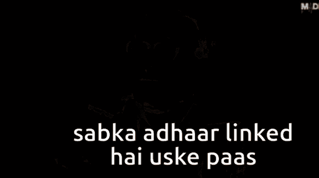 a man with glasses and a beard says sabka adhaar linked hai uske paas
