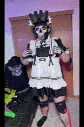 a person in a maid costume with a skull mask