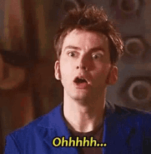 a man in a blue jacket is making a surprised face and saying ohhhh ...