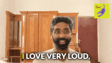a man with a beard says " i love very loud " in front of a wardrobe
