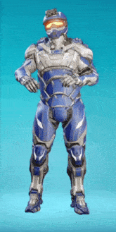 a man in a futuristic suit is standing on a blue surface .
