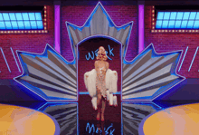 a woman stands in front of a canadian maple leaf with the word weak written on it