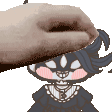 a person is petting a cartoon character 's head with a hand .