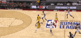 a basketball game is being played in front of a banner that says mgm resort summer league