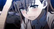 a close up of a sad anime girl crying with tears running down her face .