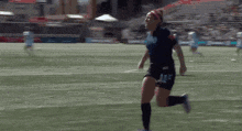 a female soccer player wearing number 11 is throwing a ball