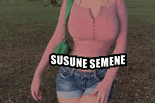 a woman wearing shorts and a pink shirt with the words susune semene written on the bottom
