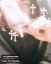 a picture of a person with crosses around their face and the words 1st @kencarson chaos tour houston