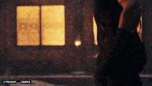 a person standing in front of a window with the hashtag pranay varma