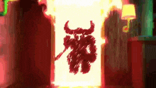 a drawing of a devil with horns is on a red wall