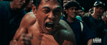 a poster for kahar shows a man screaming in a boxing ring