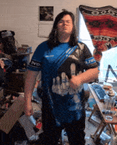a person wearing a blue shirt that says evox on it
