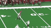 a football game is being played on a field with the number 30 on the sidelines
