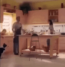 a kitchen with pink cabinets and a ladder in the middle of it