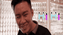 a man making a funny face with hi hi written in the background