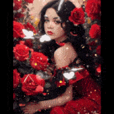a woman in a red dress is surrounded by red roses and white butterflies