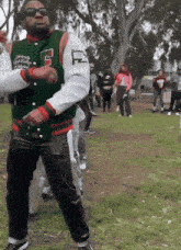 a man in a varsity jacket with the letter s on it