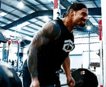 roman-reigns-weightlifting.gif